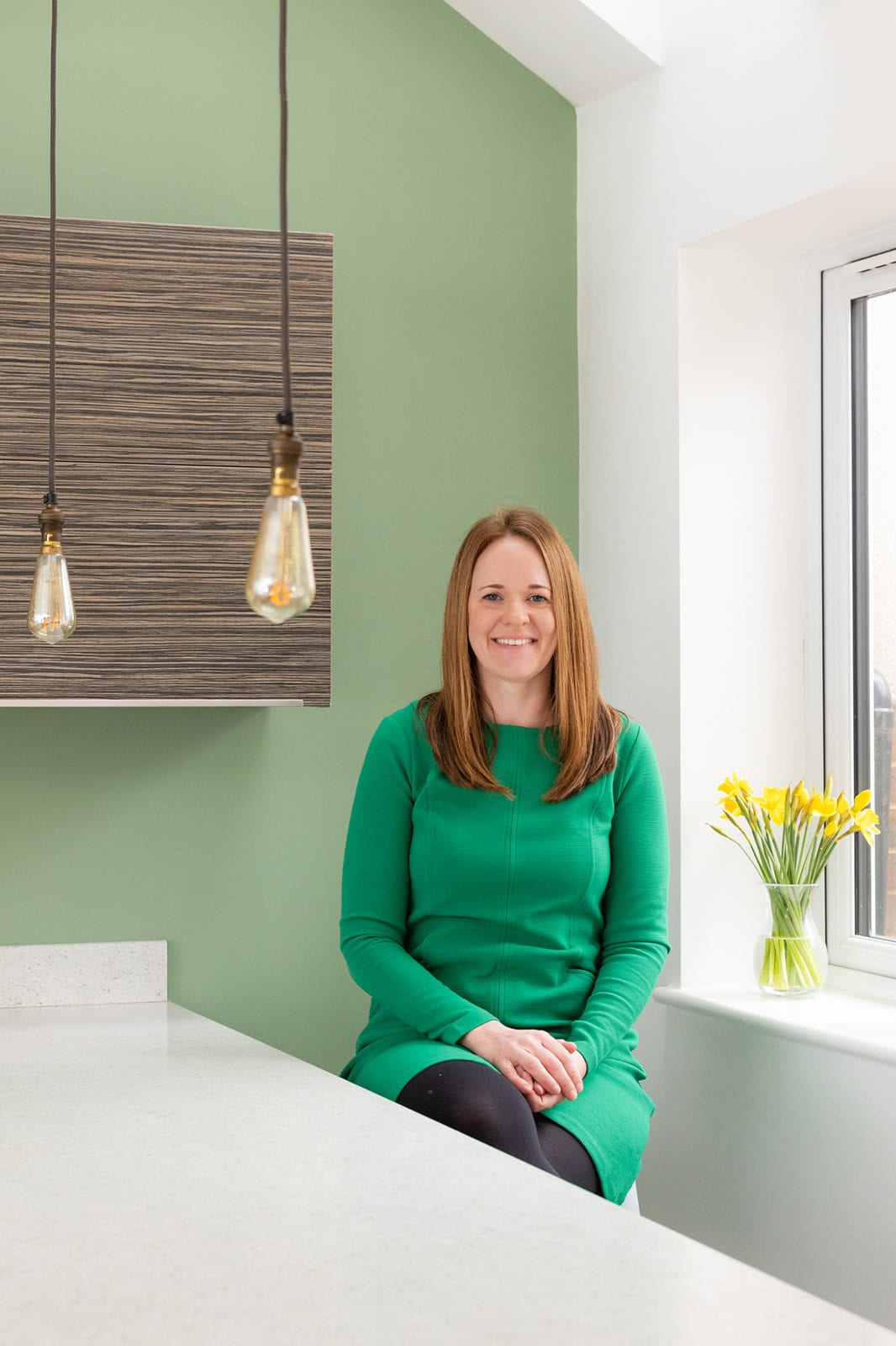 Woman in a styled interior setting during a brand photography session