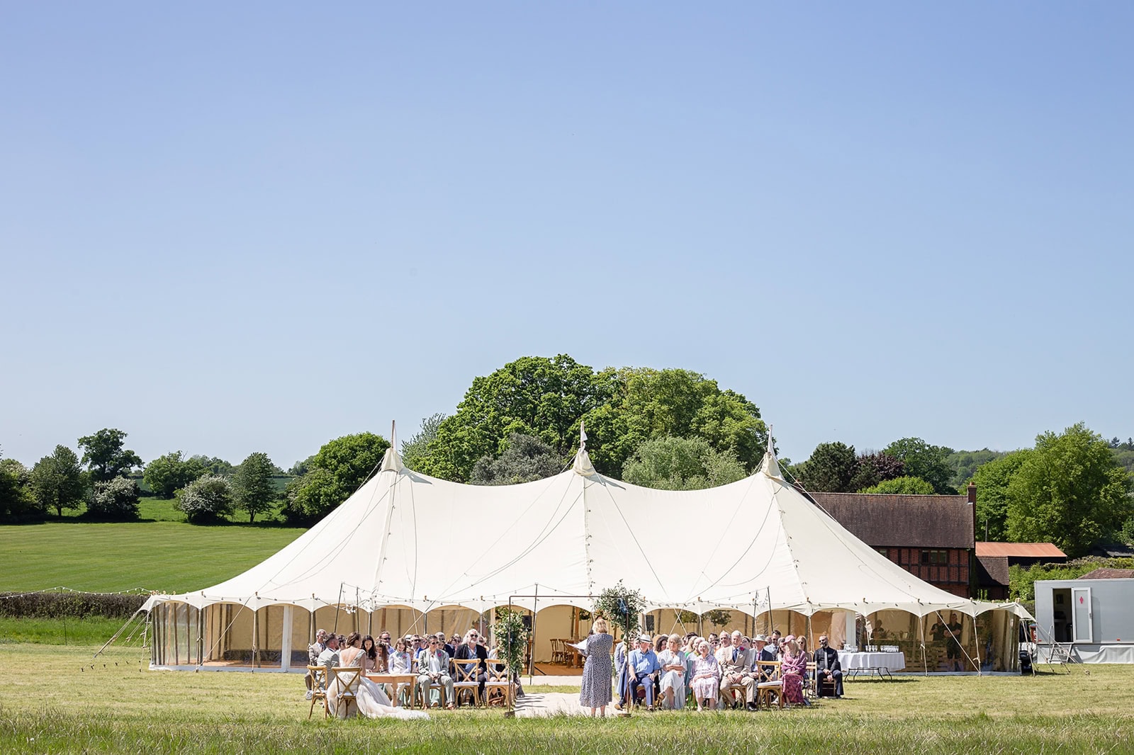 Marquee wedding in a field in Aldbury in the middle of the English summer