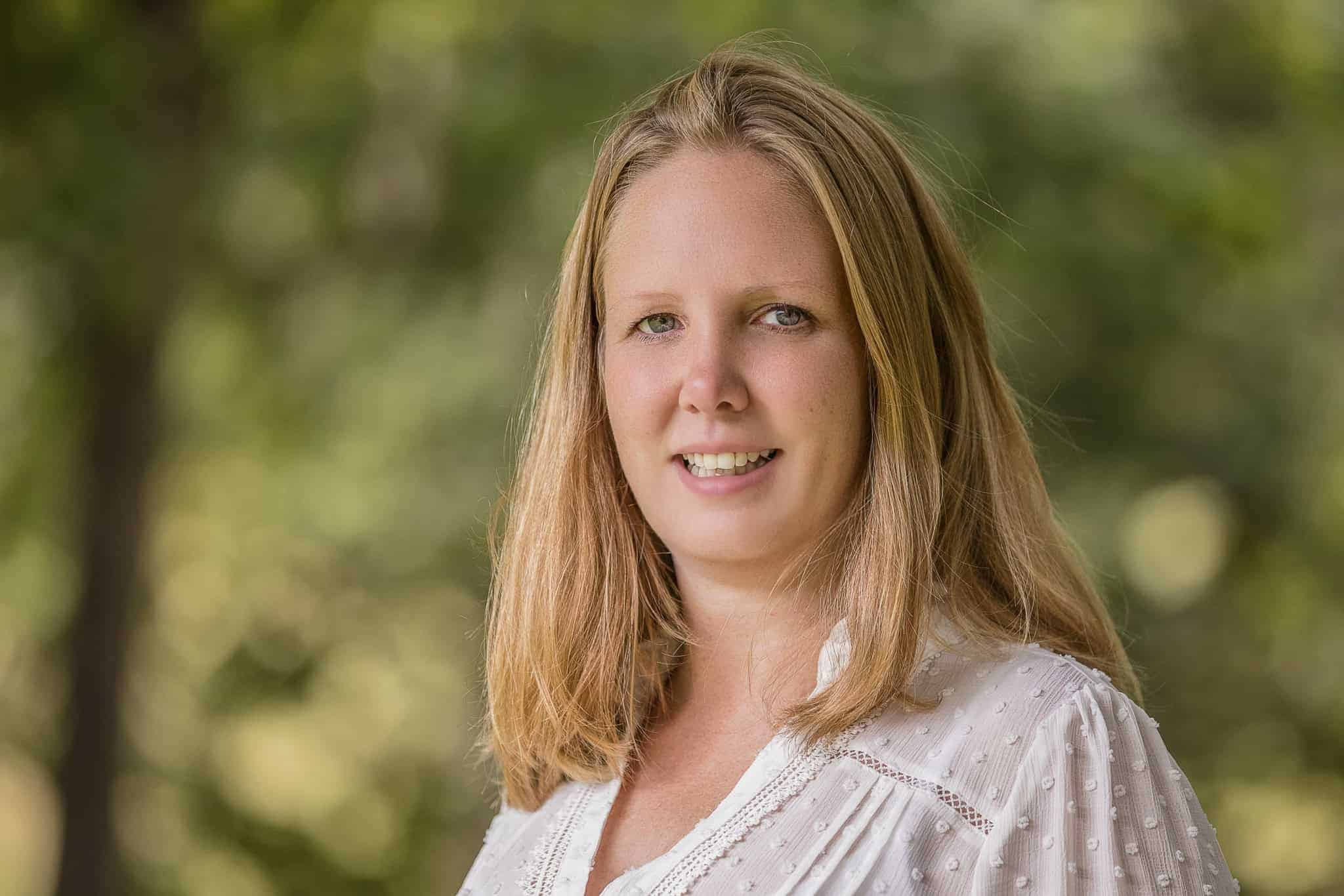 A professional headshot of Lyndsey looking at the camera and smiling