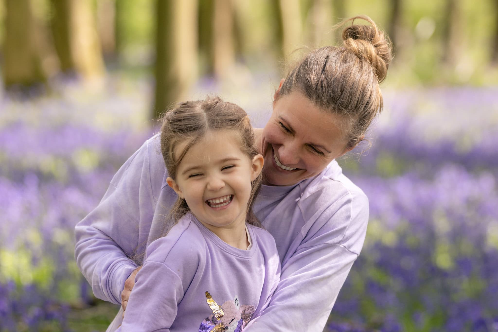 A mother and daughter play in the bluebells near Berkhamsted