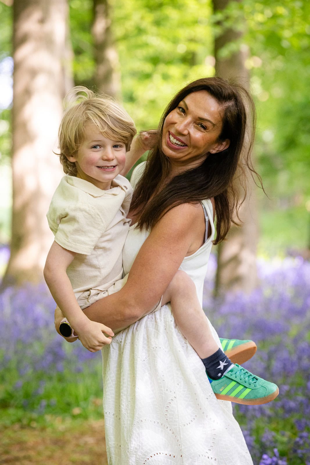 A mother and her son play in the bluebells near Berkhamsted