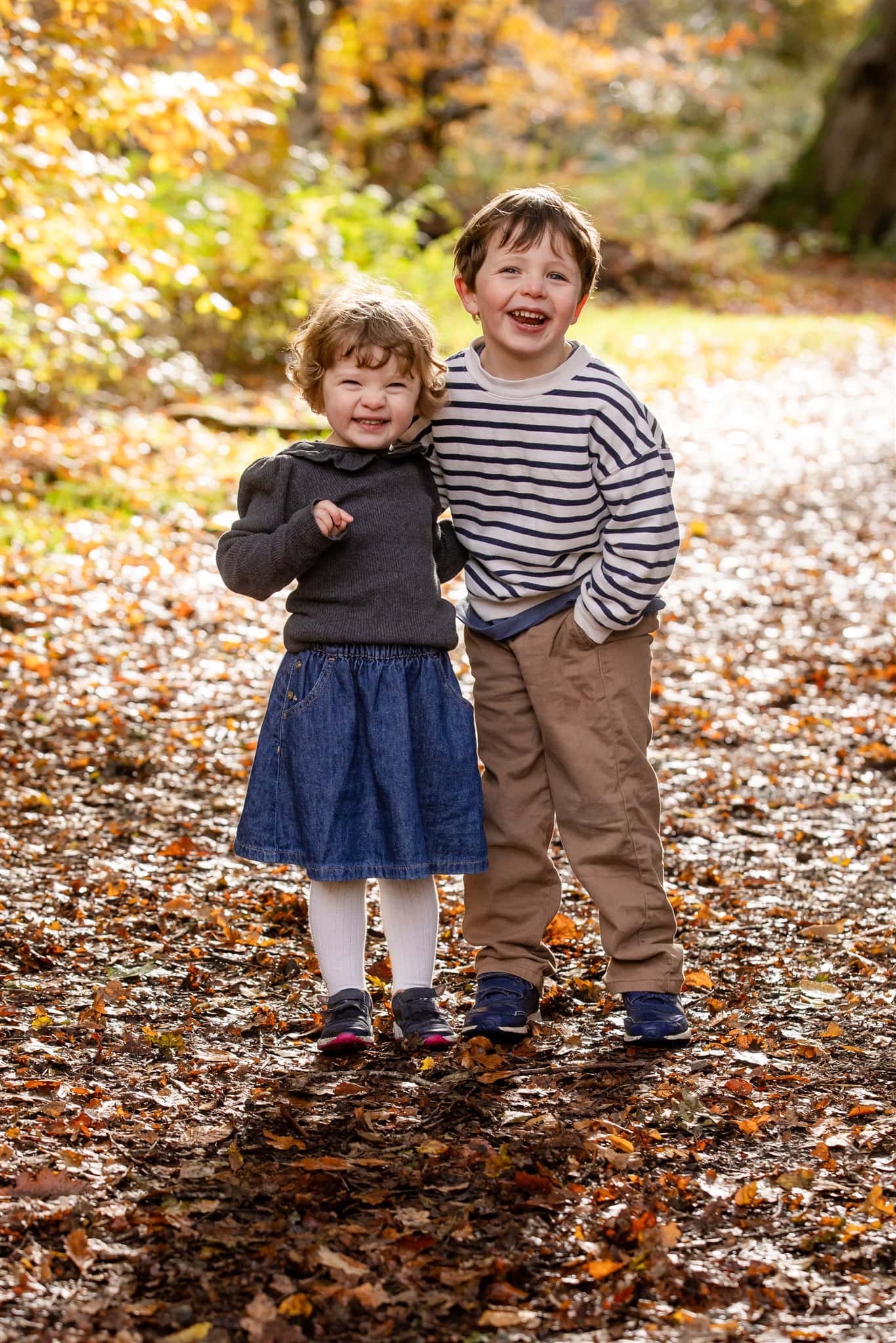 Two young children laugh at the camera near Chesham